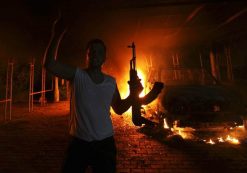 An Islamic extremist celebrates as the U.S. Consulate in Benghazi burns after the terror attack that claimed the lives of 4 Americans on September 11, 2012. (Photo: Reuters)