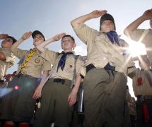 Boy Scouts of America salute during a 