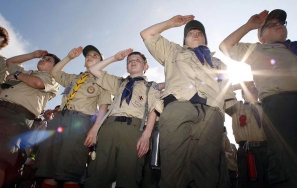 Boy Scouts of America salute during a 