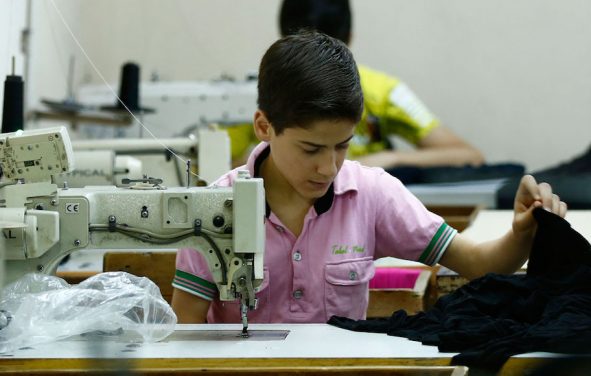 Muhamed Awwal, a 13-year-old from Syria, works in his father's basement factory in Istanbul. Around 665,000 school-age Syrian children who live in Turkey are not in school. (Photo: Syria)