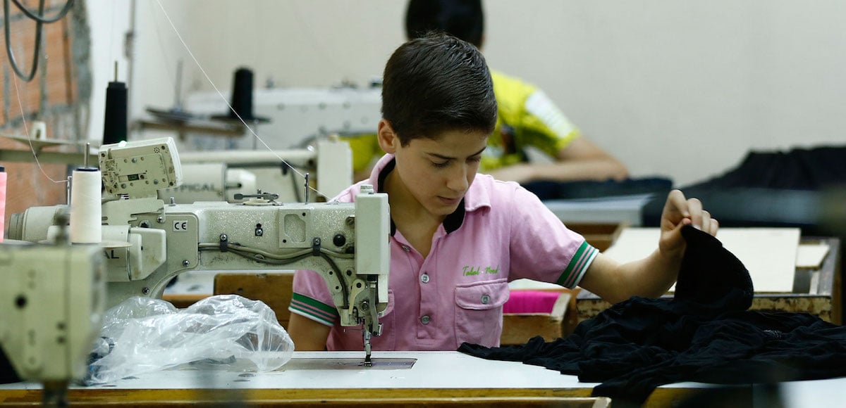 Muhamed Awwal, a 13-year-old from Syria, works in his father's basement factory in Istanbul. Around 665,000 school-age Syrian children who live in Turkey are not in school. (Photo: Syria)