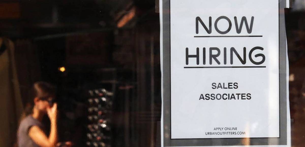 A "Now Hiring" sign hangs on the door to the Urban Outfitters store at Quincy Market in Boston, Massachusetts September 5, 2014. (Photo: Reuters)
