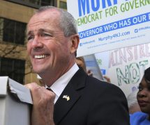 New Jersey Democratic gubernatorial candidate Phil Murphy rests his hand on a box of petitions as he answers a question before delivering the petitions to meet Monday's deadline for candidates to file petitions to run, Monday, April 3, 2017, in Trenton, N.J. (Photo: AP)