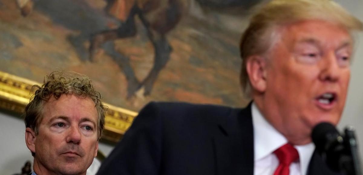 U.S. Senator Rand Paul (R-KY) listens as U.S. President Donald Trump speaks before signing an executive order making it easier for Americans to buy bare-bones health insurance plans and circumvent Obamacare rules at the White House in Washington, U.S., October 12, 2017. (Photo: Reuters)