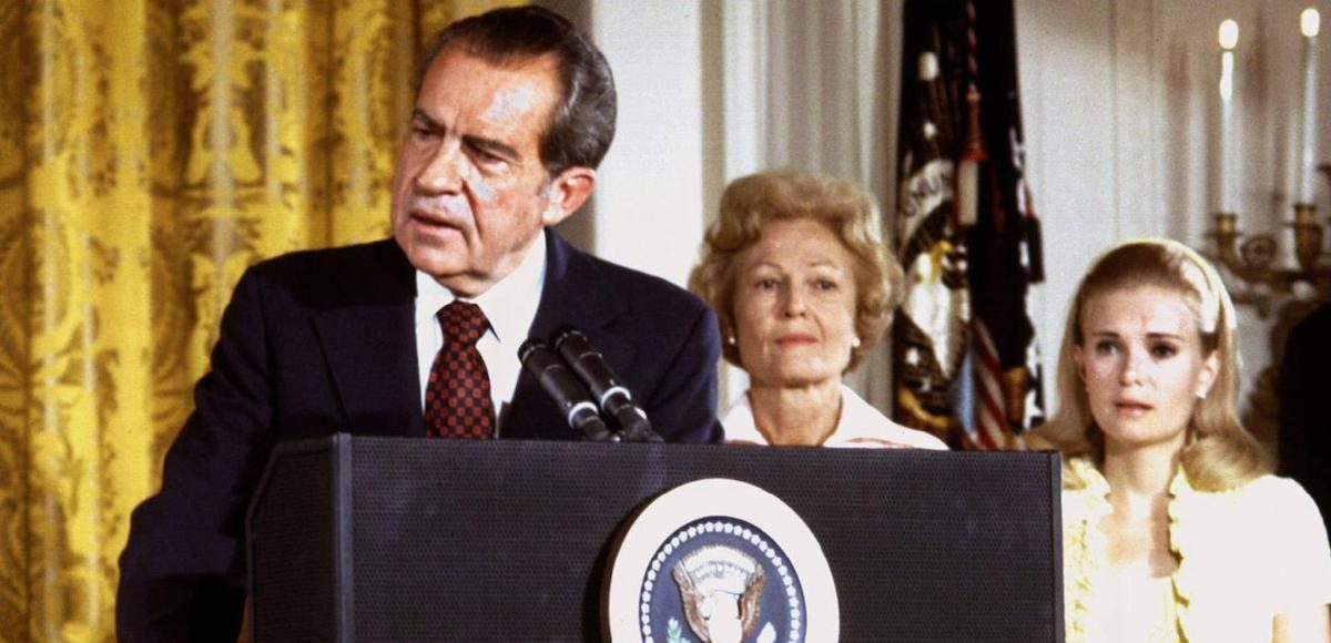U.S. President Richard Nixon (L), listened to by First lady Pat Nixon and daughter Tricia Nixon (R), says goodbye to family and staff in the White House East Room on August 9, 1974. (Photo: Reuters)
