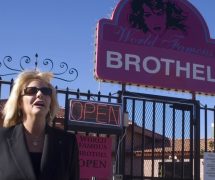 Susan Austin, the madam at the Wild Horse Adult Resort & Spa outside Reno, poses outside the World Famous Brothel in Nevada. (Photo: Reuters)