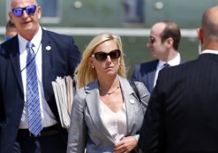 Kirstjen Nielsen, Chief of Staff of U.S. Department of Homeland Security, center, walks to Air Force One as she departs Tuesday, Aug. 22, 2017, at Andrews Air Force Base, Md. President Donald Trump is en route to Arizona and Nevada. (AP Photo/Alex Brandon)