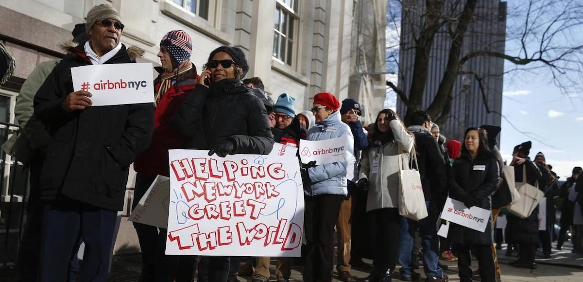 Supporters of Airbnb stand during a rally before a hearing called 'Short Term Rentals: Stimulating the Economy or Destabilizing Neighborhoods?' at City Hall in New York, January 20, 2015. (Photo: Reuters)