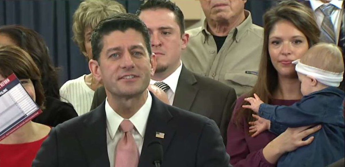 House Speaker Paul Ryan, R-Wis., holds up a post card form during the introduction of the Republican tax reform plan, dubbed the "Tax Cuts and Jobs Act," on Thursday November 2, 2017.