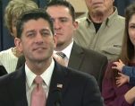 House Speaker Paul Ryan, R-Wis., holds up a post card form during the introduction of the Republican tax reform plan, dubbed the 