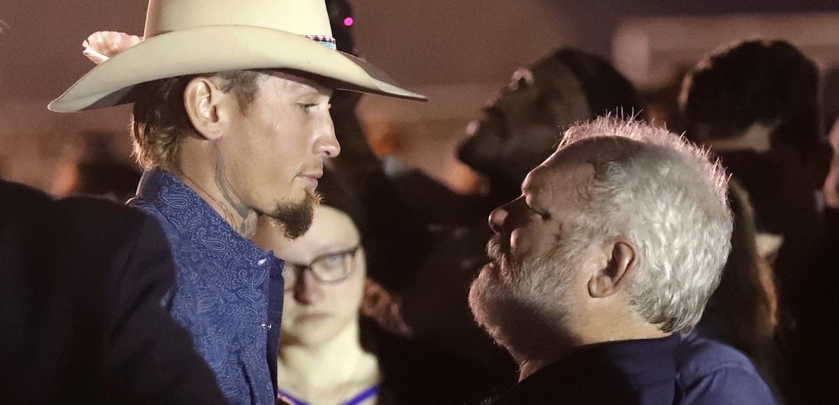 Stephen Willeford, right, hugs Johnnie Langendorff during a vigil for the victims of the First Baptist Church shooting Monday, Nov. 6, 2017, in Sutherland Springs, Texas. Willeford shot suspect Devin Patrick Kelley and Langendorff drove the truck while they chased Kelley. Kelley opened fire inside the church in the small South Texas community on Sunday, killing more than two dozen and injuring others. (Photo: AP)