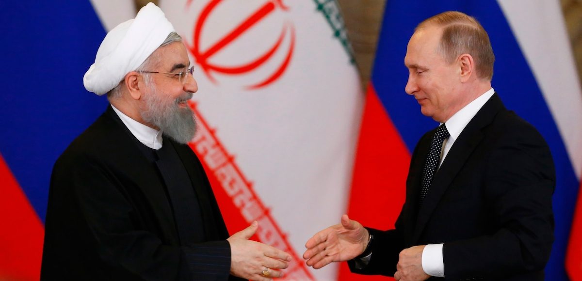 Russian President Vladimir Putin shakes hands with Iranian President Hassan Rouhani during a joint news conference following their meeting at the Kremlin in Moscow, Russia March 28, 2017. (Photo: Reuters)