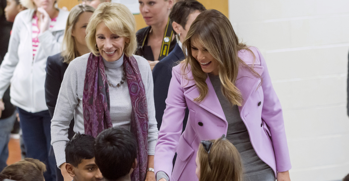 Secretary of Education Betsy DeVos, left, and First Lady Melania Trump chat with students during a visit to Orchard Lake Middle School in West Bloomfield, Mich., Monday, Oct. 23, 2017. (AP)