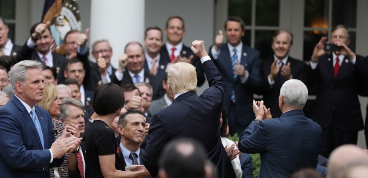 U.S. President Donald Trump, center, celebrates with Congressional Republicans in the Rose Garden of the White House after the U.S. House of Representatives and Senate approved the American Healthcare Act, to repeal major parts of ObamaCare and replace it with the Republican healthcare plan, in Washington, U.S., May 4, 2017. (Photo: Reuters)