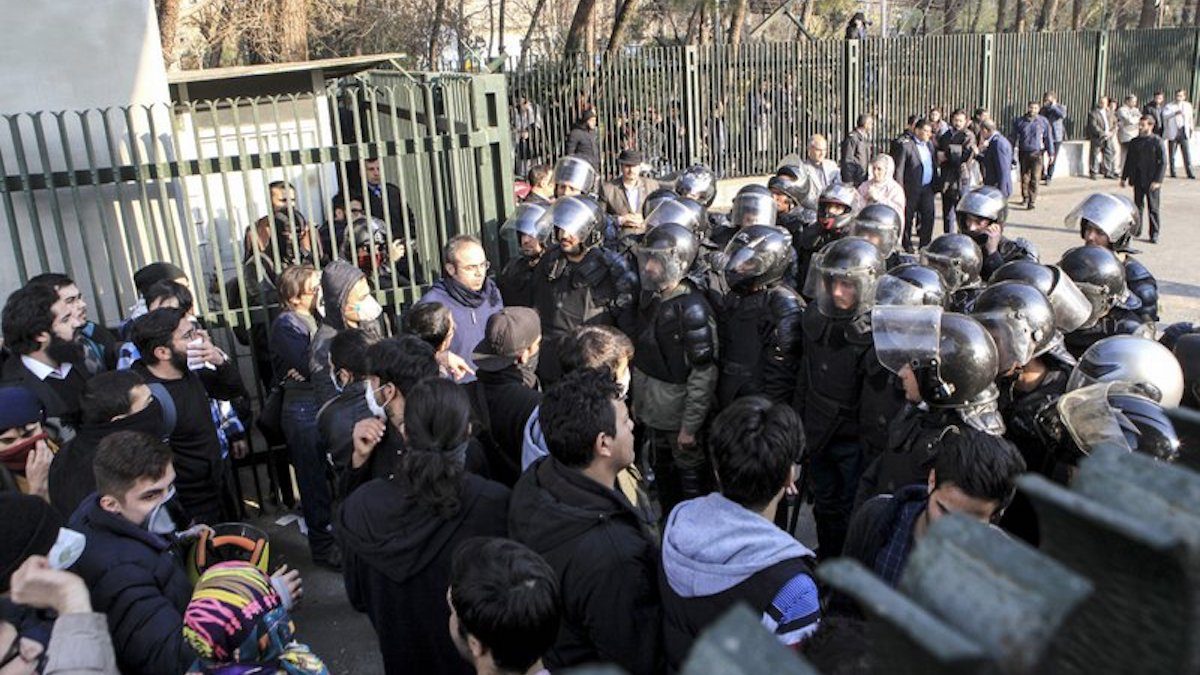 In this photo taken by an individual not employed by the Associated Press and obtained by the AP outside Iran, anti-riot Iranian police prevent university students to join other protesters over Iran weak economy, in Tehran, Iran, Saturday, Dec. 30, 2017. A wave of spontaneous protests over Iran’s weak economy swept into Tehran on Saturday, with college students and others chanting against the government just hours after hard-liners held their own rally in support of the Islamic Republic’s clerical establishment. (Photo: AP)