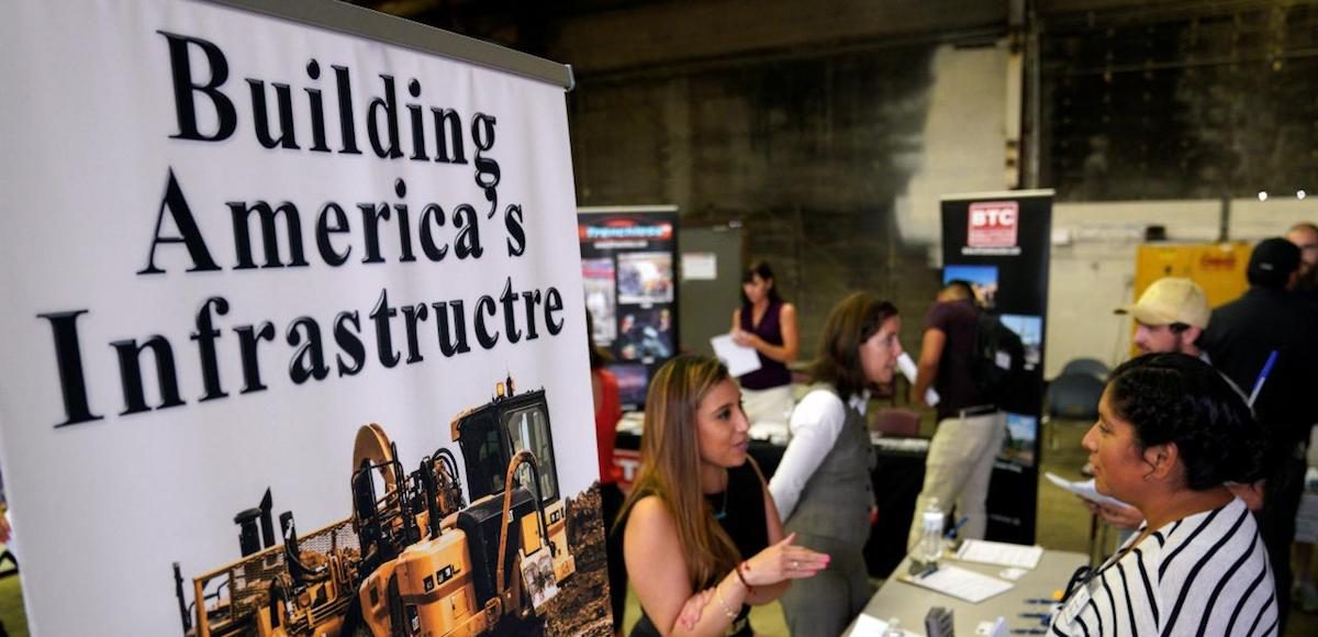 A recruiter talks with a job seeker at the Construction Careers Now! hiring event in Denver, Colorado U.S. August 2, 2017. (Photo: Reuters)