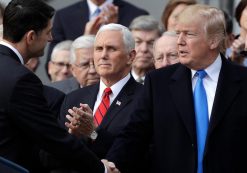President Donald Trump shakes hands with House Speaker Paul Ryan of Wis., as Vice President Mike Pence and Congressional Republicans look on during a celebratory bill passage event following the final passage of the Tax Cuts and Jobs Act by Congress. (Photo: AP)