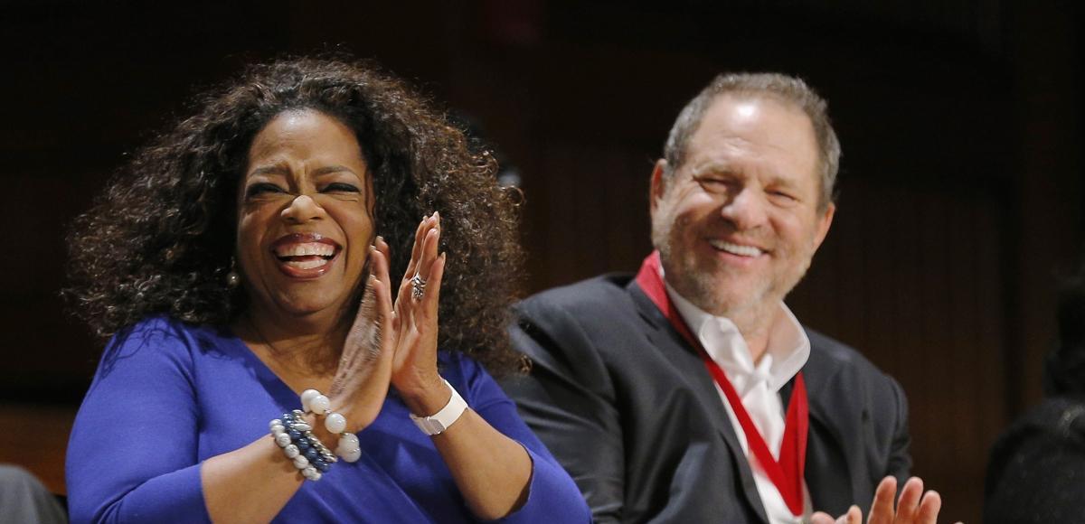 Oprah Winfrey, left, receives the W.E.B. Du Bois Medal at Harvard University's Sanders Theatre on Tuesday., along with producer Harvey Weinstein, right. (Photo: AP)