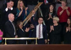 North Korean defector Ji Seong-ho raises his crutches as President Donald Trump delivers the State of the Union address at the U.S. Capitol in Washington, D.C. on Jan. 30, 2018.