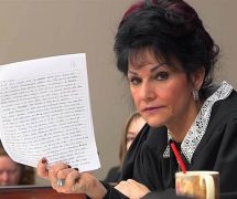 Circuit Court Judge Rosemarie Aquilina holds up a letter written by Larry Nassar, the former U.S.A. gymnastics doctor who plead guilty to molesting young girls.