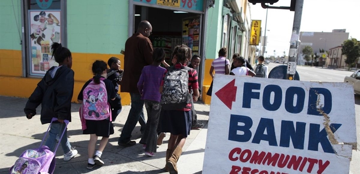 Regional coordinator Charles Evans (4th L) picks up children from school to take them to an after-school program at South Los Angeles Learning Center in Los Angeles, California March 16, 2011. (Photo: Reuters)