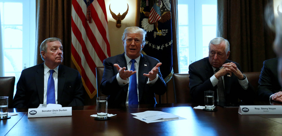U.S. President Donald Trump, flanked by U.S. Senator Dick Durbin (D-IL) and Representative Steny Hoyer (D-MD), holds a bipartisan meeting with legislators on immigration reform at the White House in Washington, U.S. January 9, 2018. (Photo: Reuters)