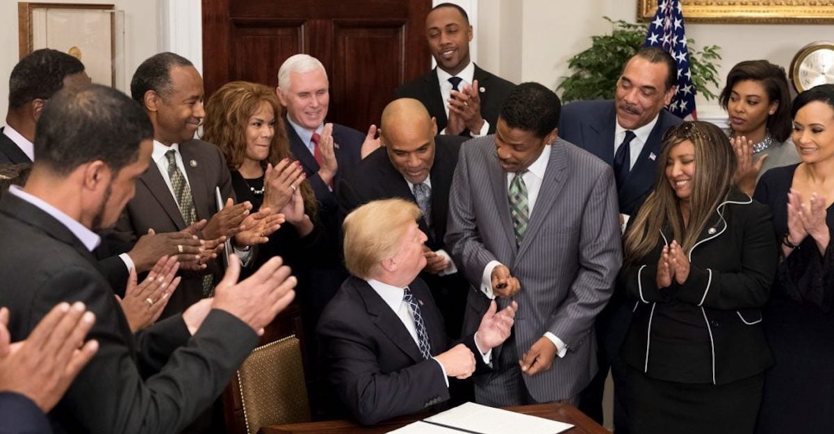 President Donald J. Trump hands a pen to Isaac Newton Farris Jr., a nephew of slain Civil Rights leader Dr. Martin Luther King, Jr., after signing a proclamation in honor of Martin Luther King, Jr., Day. (Photo: White House)