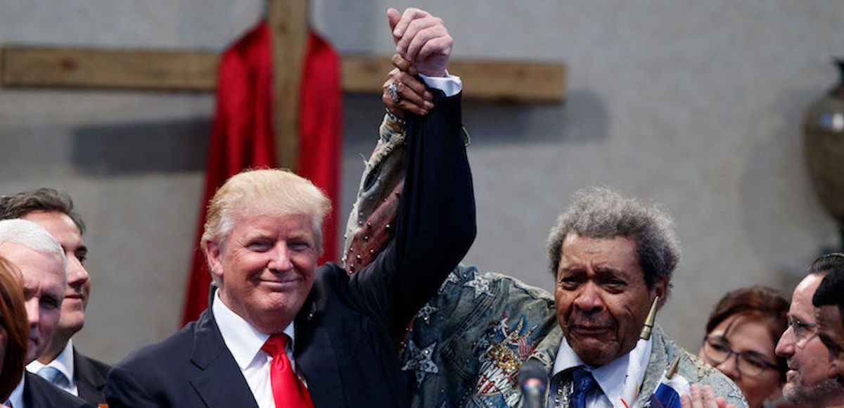 Boxing promoter Don King, right, holds up the hand of Republican presidential candidate Donald Trump during a visit to the Pastors Leadership Conference at New Spirit Revival Center, Wednesday, Sept. 21, 2016, in Cleveland, Ohio. (AP Photo)