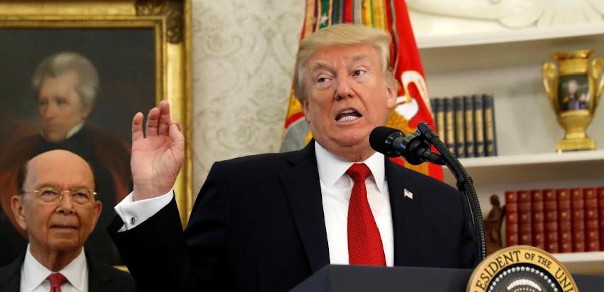 Commerce Department Secretary Wilbur Ross, left, listens as President Donald Trump speaks at the White House. (Photo: Reuters)