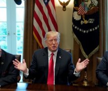 Chairman, CEO and President of Nucor John Ferriola and U.S. Steel CEO Dave Burritt flank U.S. President Donald Trump as he announces his administration will levy new tariffs to product U.S. steel and aluminum manufacturing companies. (Photo: Reuters)
