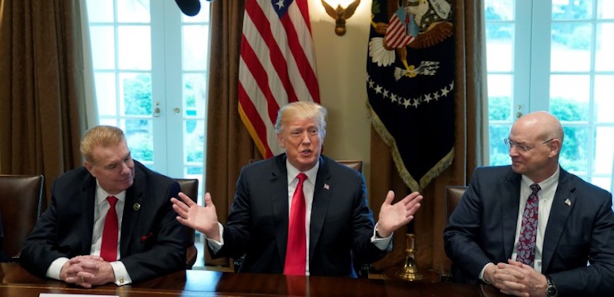 Chairman, CEO and President of Nucor John Ferriola and U.S. Steel CEO Dave Burritt flank U.S. President Donald Trump as he announces his administration will levy new tariffs to product U.S. steel and aluminum manufacturing companies. (Photo: Reuters)