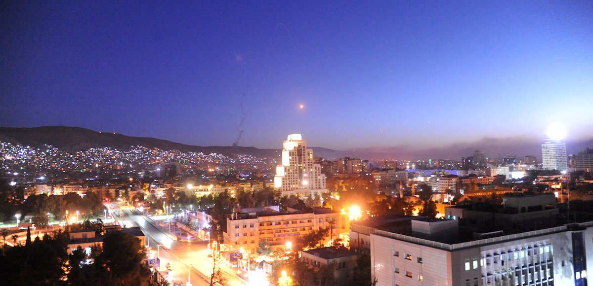 A missile is seen crossing over Damascus, Syria April 14, 2018. (Photo: SANA/Handout via Reuters)