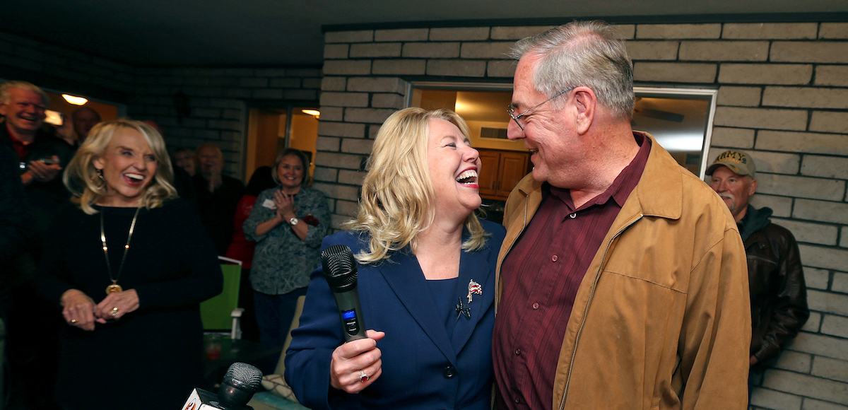 Republican candidate and former Arizona state Sen. Debbie Lesko celebrates with her husband, Joe, after voting results show her victory in a special primary election for Arizona’s 8th Congressional District seat during a campaign party at Lesko’s home in Glendale, Ariz., on Feb. 27, 2018. (Photo: AP)