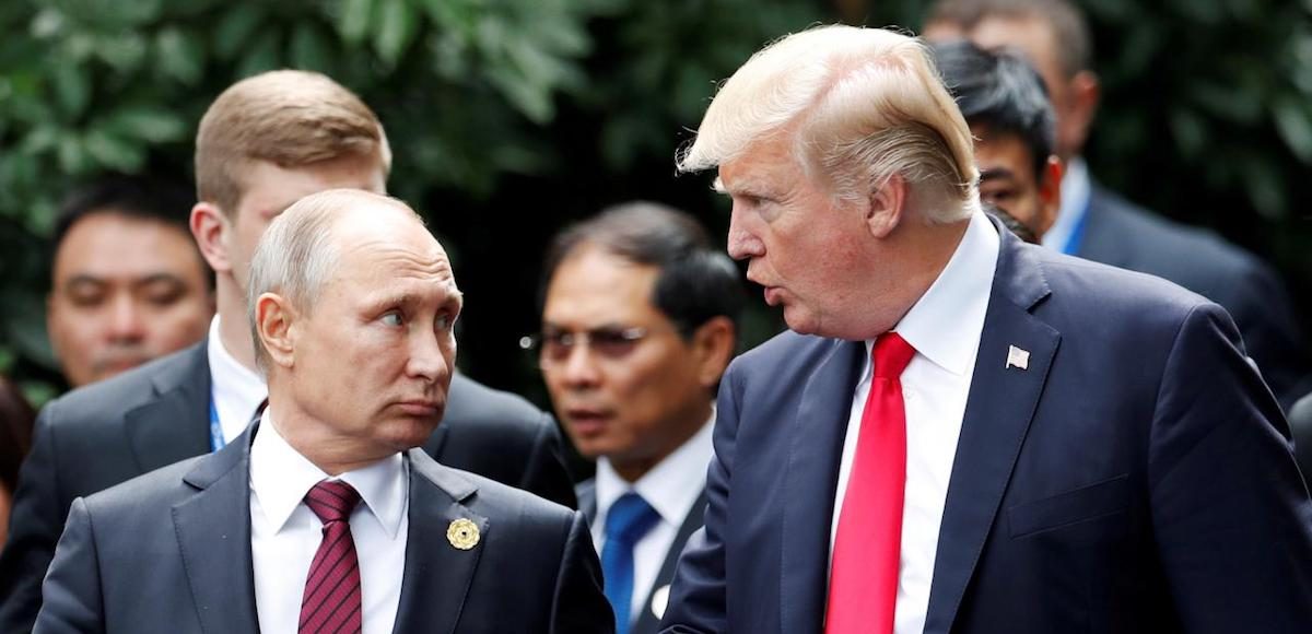 U.S. President Donald Trump and Russia's President Vladimir Putin talk during the family photo session at the APEC Summit in Danang, Vietnam November 11, 2017. (Photo: Reuters)