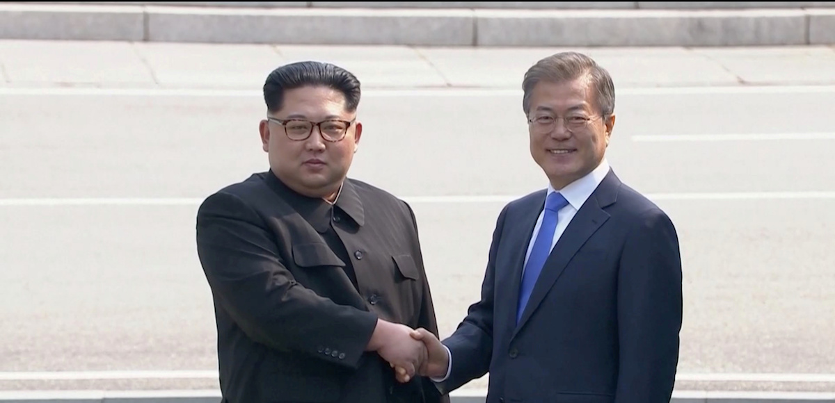 North Korean leader Kim Jong Un shakes hands with South Korean President Moon Jae-in as both of them arrive for the inter-Korean summit at the truce village of Panmunjom, in this still frame taken from video, South Korea April 27, 2018. (Photo: Host Broadcaster via REUTERS TV)