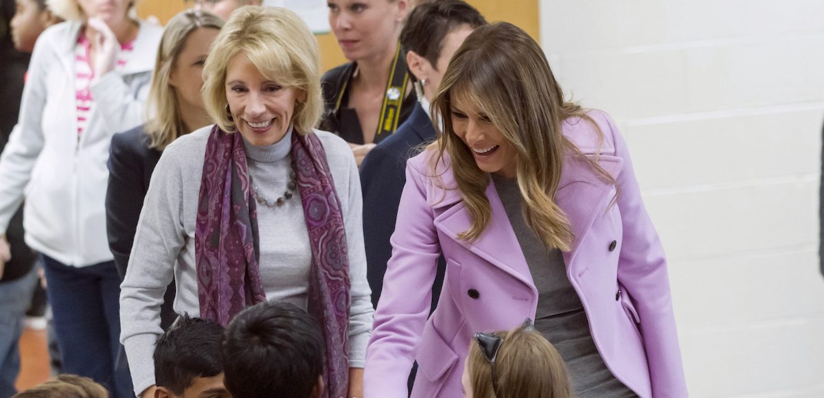 Secretary of Education Betsy DeVos, left, and First Lady Melania Trump chat with students during a visit to Orchard Lake Middle School in West Bloomfield, Mich., Monday, Oct. 23, 2017. (AP)