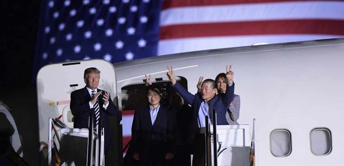 President Donald Trump, from left, greets Tony Kim, Kim Hak Song, seen in the shadow, and Kim Dong Chul, three Americans detained in North Korea for more than a year, as they arrive at Andrews Air Force Base in Md., Thursday, May 10, 2018. First lady Melania Trump also greet them at right. (Photo: AP)