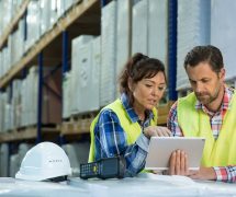 Employees have short meeting in the warehouse to check business inventory levels of goods. First in first out. (Photo: AdobeStock)