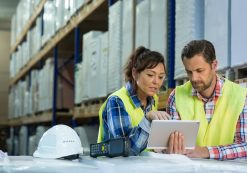 Employees have short meeting in the warehouse to check business inventory levels of goods. First in first out. (Photo: AdobeStock)