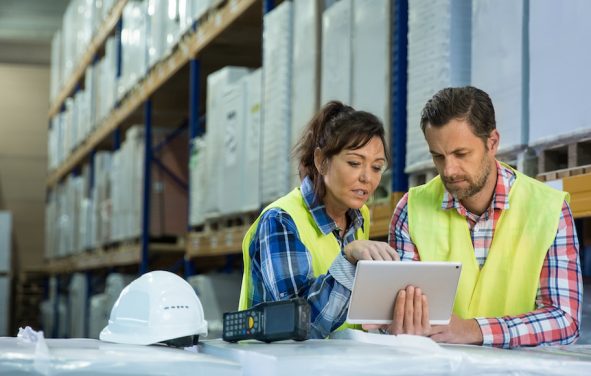 Employees have short meeting in the warehouse to check business inventory levels of goods. First in first out. (Photo: AdobeStock)