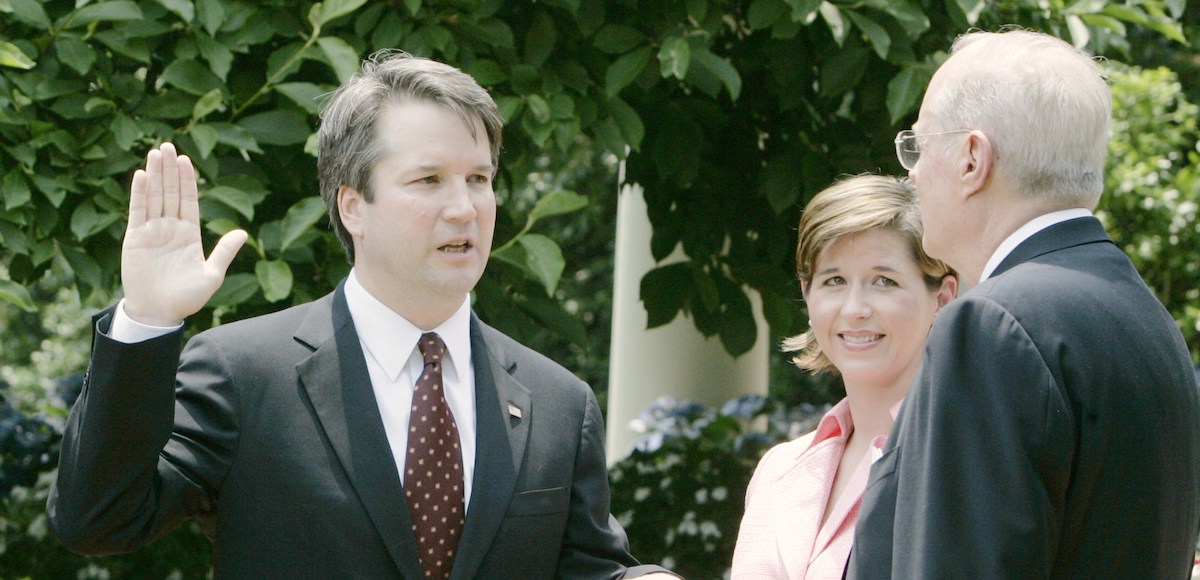 Brett Kavanaugh is sworn in as a judge in the U.S. Court of Appeals for the District of Columbia by Supreme Court Associate Justice Anthony Kennedy in a Rose Garden ceremony at the White House in Washington June 1, 2006. (Photo: Reuters)