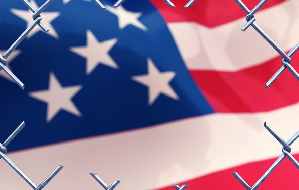 Cut fence and an American flag as a 3D concept illustrating Illegal immigration. (Photo: AdobeStock)