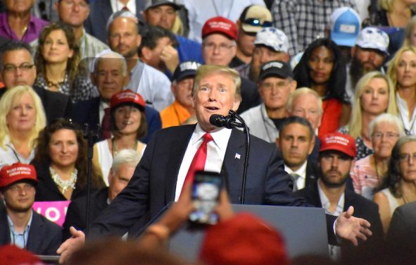 President Donald Trump jokes with the crowd President Donald Trump touts record low unemployment for minorities during a rally in Tampa, Florida on Tuesday, July 31, 2018. (Photo: Laura Baris/People's Pundit Daily)