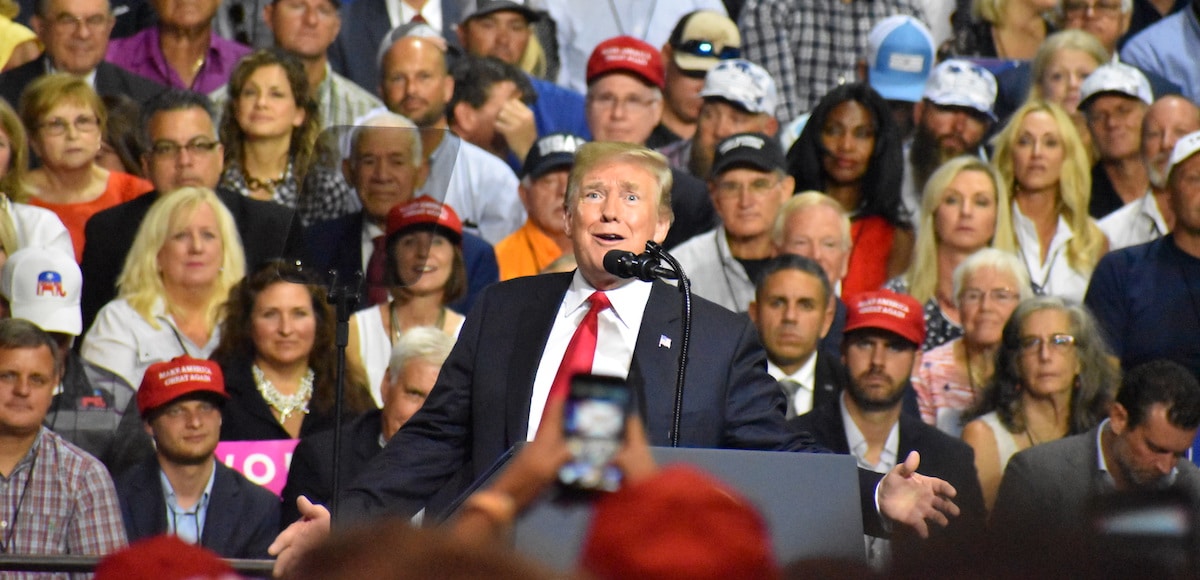 President Donald Trump jokes with the crowd President Donald Trump touts record low unemployment for minorities during a rally in Tampa, Florida on Tuesday, July 31, 2018. (Photo: Laura Baris/People's Pundit Daily)