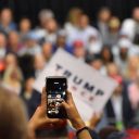 A support tries to capture a photo/video of President Donald Trump President Donald Trump jokes with the crowd President Donald Trump touts record low unemployment for minorities during a rally in Tampa, Florida on Tuesday, July 31, 2018. (Photo: Laura Baris/People's Pundit Daily)