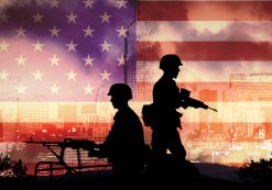 Silhouettes of U.S. soldiers on a Humvee in front of an American flag. (Photo: AdobeStock)