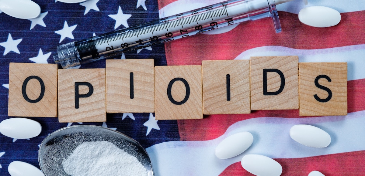 Scrabble-like text depicting opioids on an American flag to underscore the opioid epidemic in the United States. (Photo: AdobeStock)