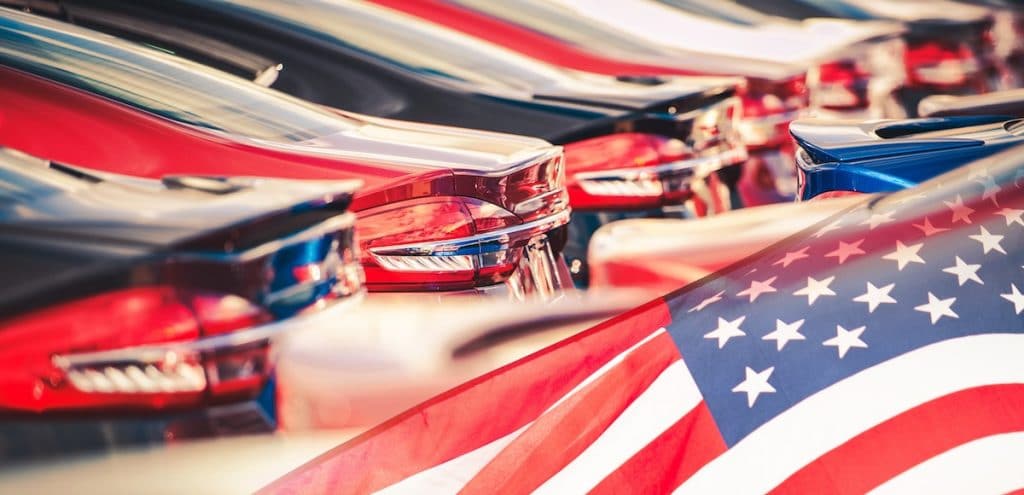 Buying American Made Cars. Supporting the American auto industry and economy photomontage with automobiles and the American Flag. (Photo: AdobeStock)