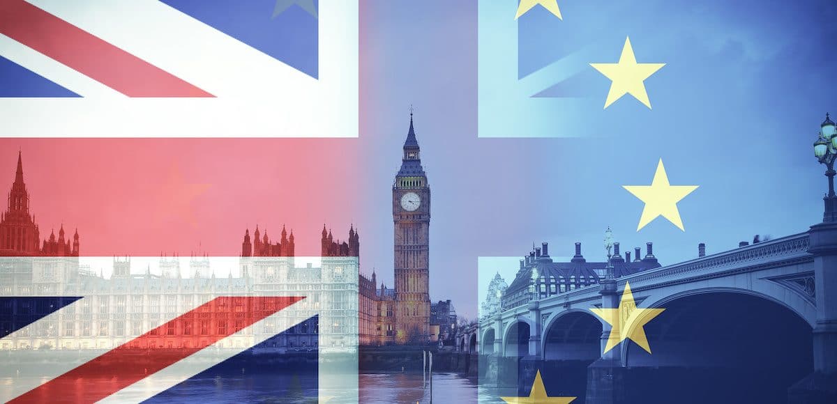 Flags of United Kingdom (UK) and European Union (EU) combined over British icons of London, for a Brexit concept. (Photo: AdobeStock)