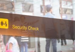 Double exposure of security check airport sign. Airport security check at gates with metal detector and scanner. (Photo: AdobeStock)